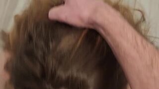 Curvy redhead gets on her knees and swallows for the first time