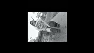 Nurse vicki models in her black and whot hogwarts outfit and spiked boots