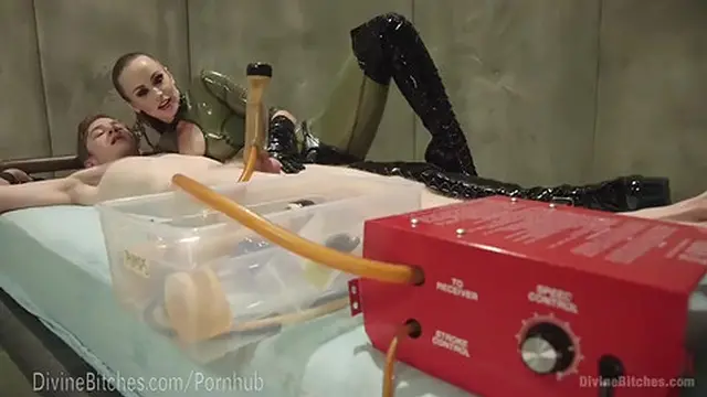 Latex Dominatrix Milks Slave Boy