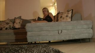 Blonde bombshell flaunts her juicy muff and long legs, underwear-free, on couch